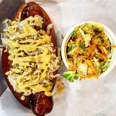 Knackwurst with Brussels and carrot salad.