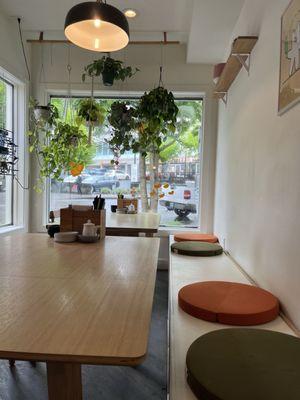 Inside decorated with plants, framed images and cushions from Snow Peak, a bougie outdoor store nearby.