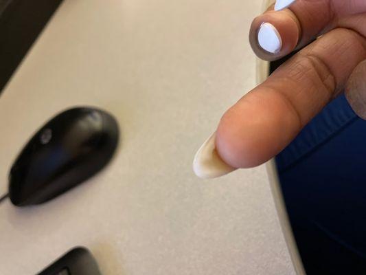 Large acrylic left underneath nails