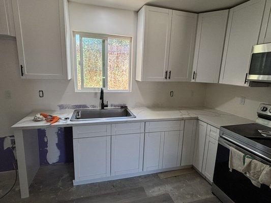 Before and after photos. Kitchen all put back together