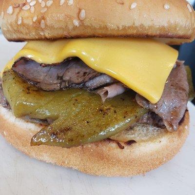 The Cowboy Burger with American Cheese and grilled Ortega's