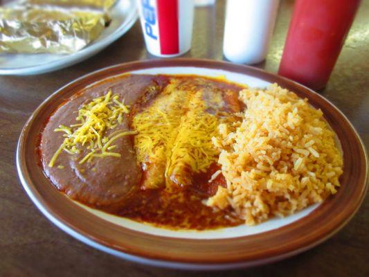 Cheese enchilada combo plate with refried beans and rice, regular portion