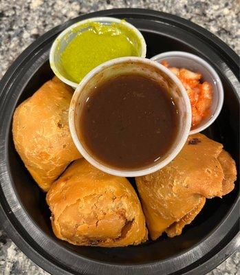 Samosa includes cilantro and sweet chutney