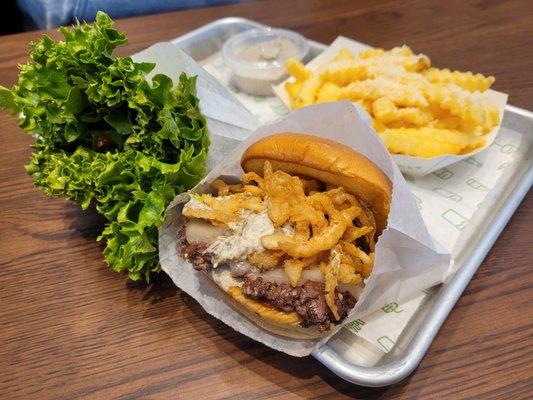 White truffle single burger and portabella mushroom patty in the grass