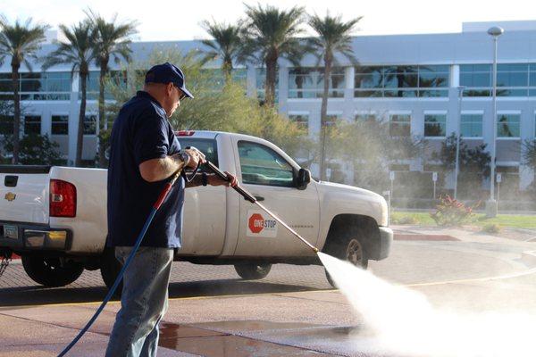 One Stop pressure washing pro hard at work making your place look great.