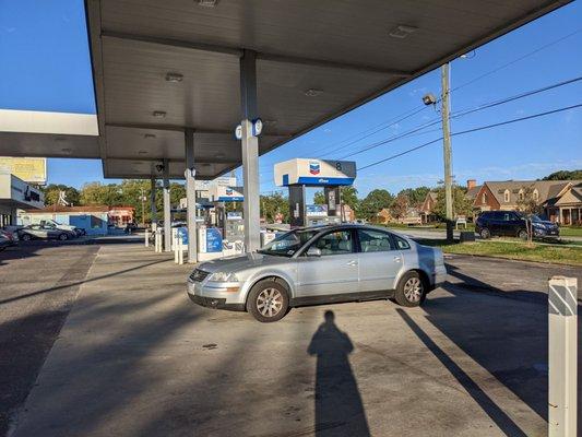 Outside the gas station. This station has 8 pumps for 3 grades of unleaded and 2 for diesel.