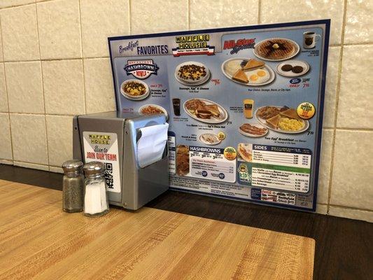 This Waffle House has physical menus available at all the tables.