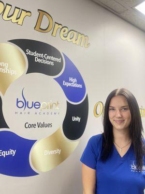 "A proud Cosmetology student at Blueprint Hair Academy, ready to start their journey toward a successful beauty career!"