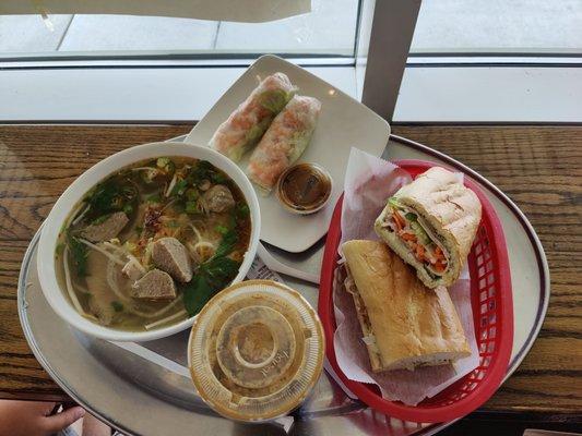 House special banh mi, house special pho, shrimp spring rolls and Vietnamese iced coffee