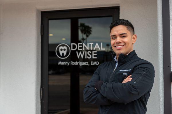 Dr. Manny Rodriguez in front of Dental Wise building