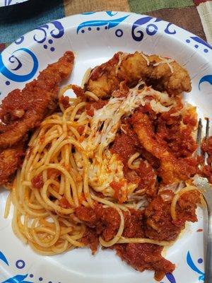 Glob of partially melted shredded mozzarella, 3 tenders and the sparse sauce from my chicken parmesan dish.