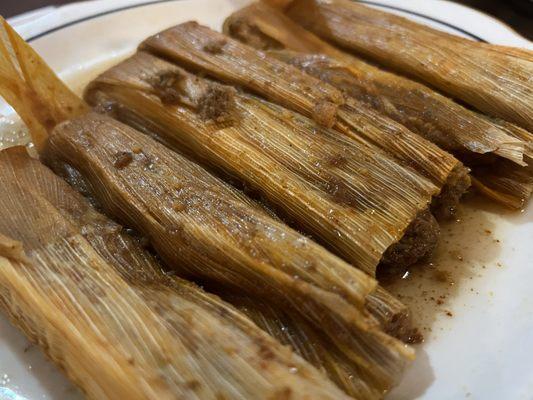 1/2 dozen tamales. Comes with crackers, hot sauce, and slaw.