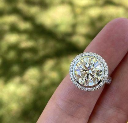 Custom made round diamond engagement ring with diamond halo and shank