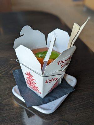 For here or to go? cocktail in a cute takeout box