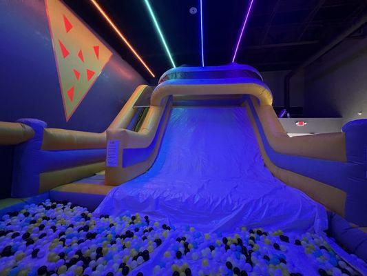 Giant slide leading into ball pit (ankle deep)