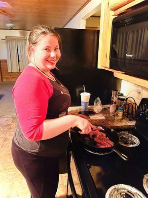 My wife cooking away first meal in cabin!