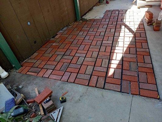 Cement and brick patio.