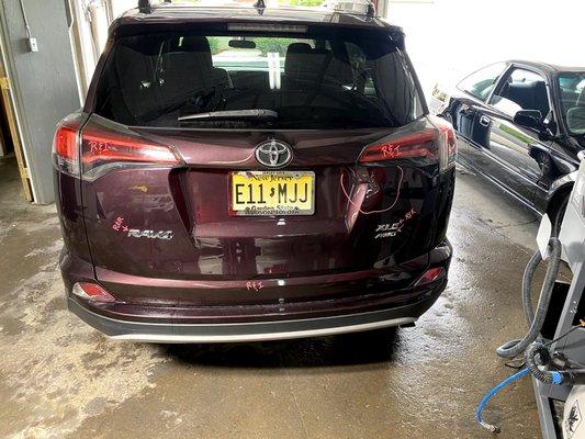 2015 Toyota RAV4 with some damage to the lift gate