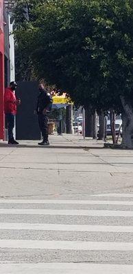 Two rude MedMen employees blocking sidewalk.