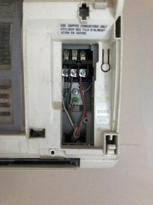 Electrical panel on unit in bedroom left open.