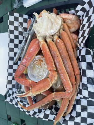 Seafood special - shrimp and crab legs included one potato and one corn.