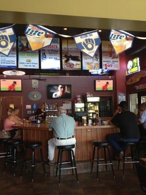 Pic of the bar w the tvs and specials hanging above