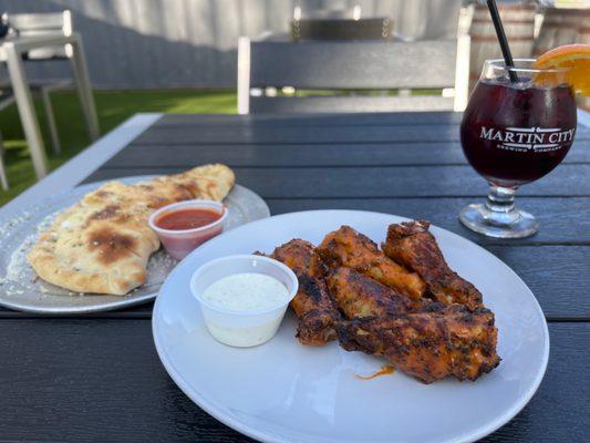 Happy hour wings and garlic cheese bread with a sangria