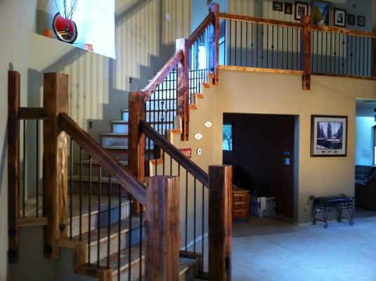 Reclaimed old growth Doug Fir stair rail with rod iron pickets