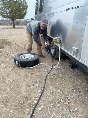 Putting on the tire we got from Oasis.