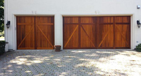 This is a steel insulated door with a wood face stained and installed by Barrett Garage doors. The door on right was $12000.00 Left $6300