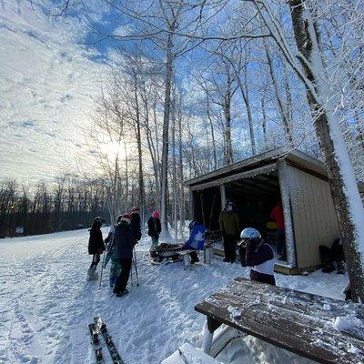 Southern Tier League Racers warming up at Emily's warming hut before their runs