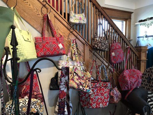 A large selection of Vera Bradley purses.