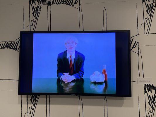 A video of Warhol eating a hamburger