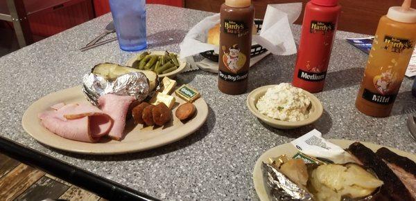 Combo Meal, sliced ham, pork sausage, green beans, baked potatoe, sour crean, frozen butter. Everything was cold. Everything!