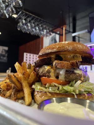 The Chicharron burger . Delicious beef patty with thick cuts of bacon stacked on top, served with our delicious house fries.