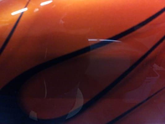 a custom painted Harley Davidson gas tank