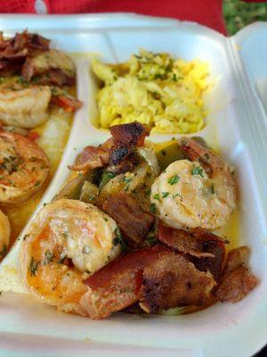 Shrimp with grits and eggs with peppers and bacon