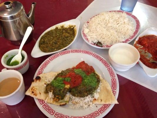 Chkn malai over saag paneer over rice over butter naan. Topped with mint chutney and raita :)