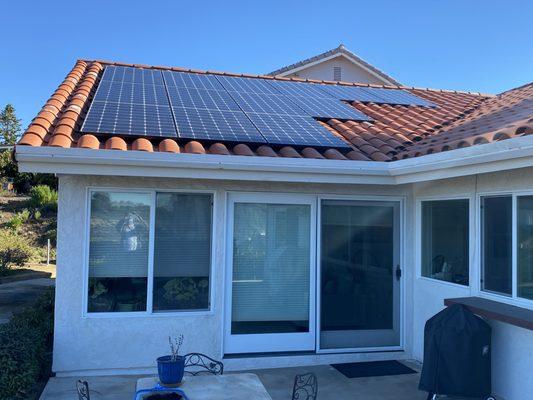 Solar installation on a clay tile roof.