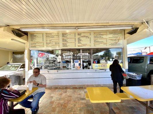 Outside menu , tables and walk up window.