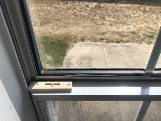 Window and caulking with double stick tape in frame