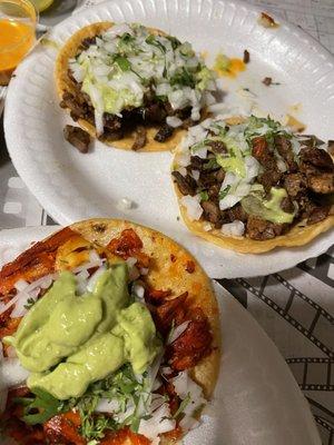 Al pastor w/ pineapple and Asada tacos. Tacos come plain (meat only), you choose your toppings. I added onions, cilantro, and avocado salsa.