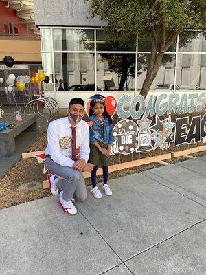 Principal Jabbar with one of our Eagle Scholars celebrating Kindergarten promotion