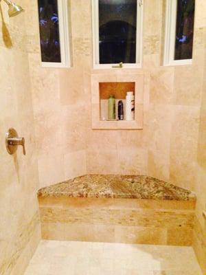 Travertine shower with Granite slab.