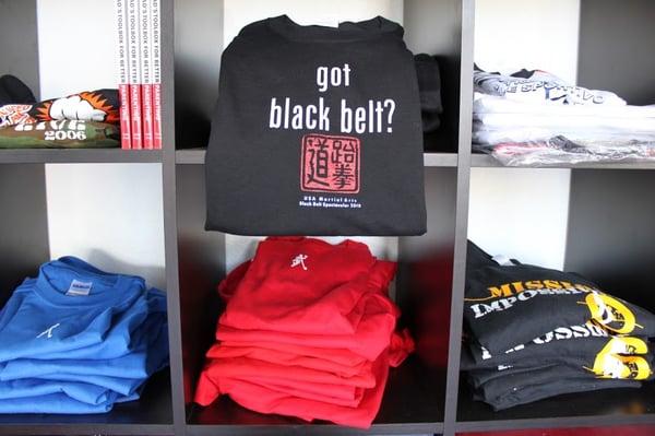 Fully stocked pro-shop with shirts and training gear.