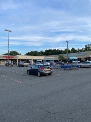 The parking lot showed not so many cars parked in front of the restaurant