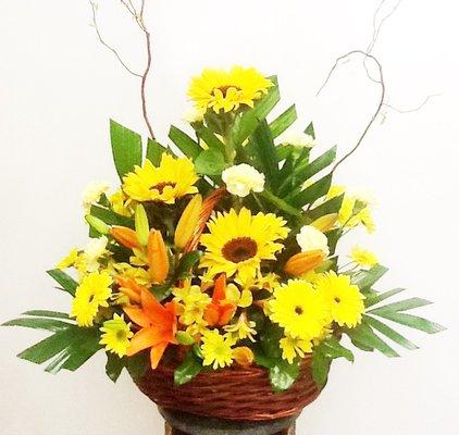 Send a sweet basket of yellow mixed flowers to friend or loved one.