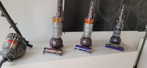 Floor ball vacuums and canister vac