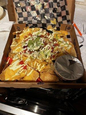 Chicken nachos, to go, BBQ sauce on the side