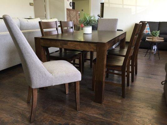 Beautiful Rustic Dining Set. Features block legs, parson chairs and wood chairs. You can also add a bench!